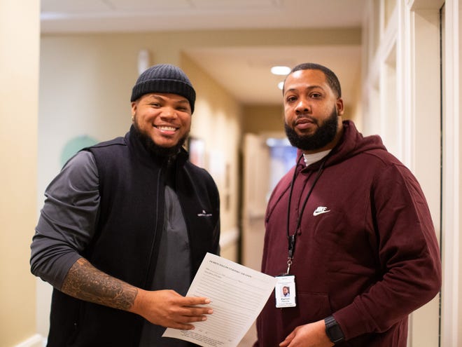 Rashawn Thompson (left) and Aaron Pennix are fellow workers in National Church Residences' Commons in Livingston.